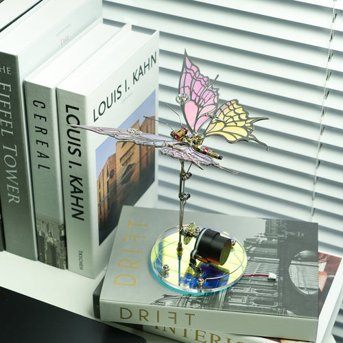 Standing butterfly ornament with multicolor wings on a clear blue disk base