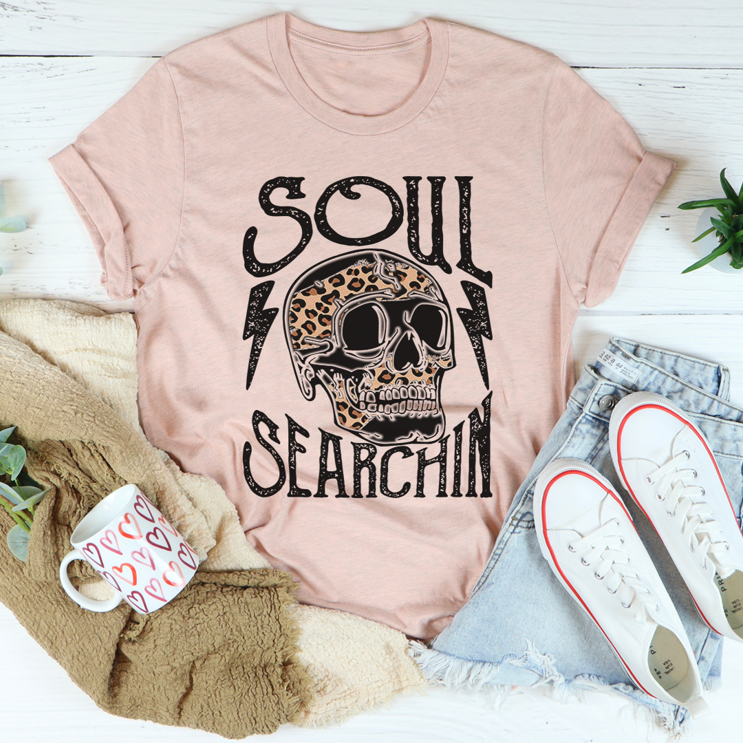 Unisex blush pink graphic T-shirt with Soul Searchin skull front print