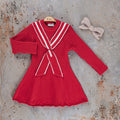 Girls red long-sleeve dress with white trim stripes and center bow at the neckline