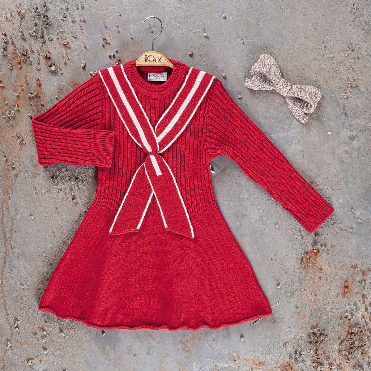 Girls red long-sleeve dress with white trim stripes and center bow at the neckline