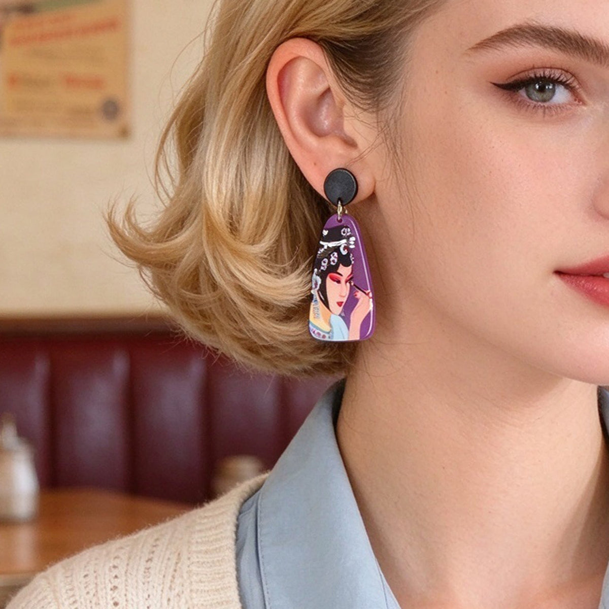 Purple opera figure dangle earrings with black round tops and portrait drop