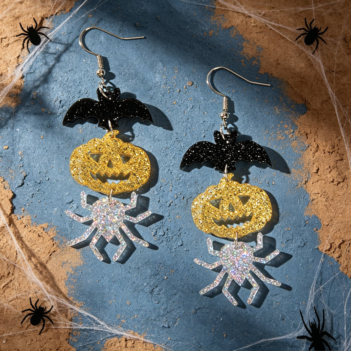 Halloween drop earrings set: black bat, gold glitter pumpkin, and silver spider charms