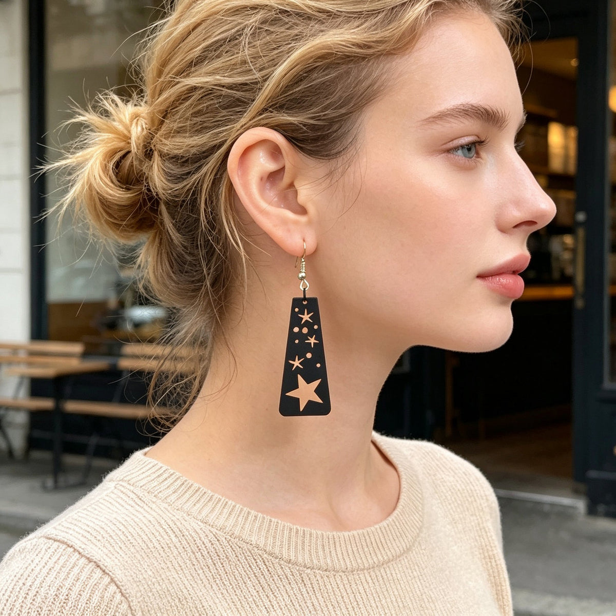 Black rectangular starry dangle earrings with moon and star symbols, gold-tone hooks