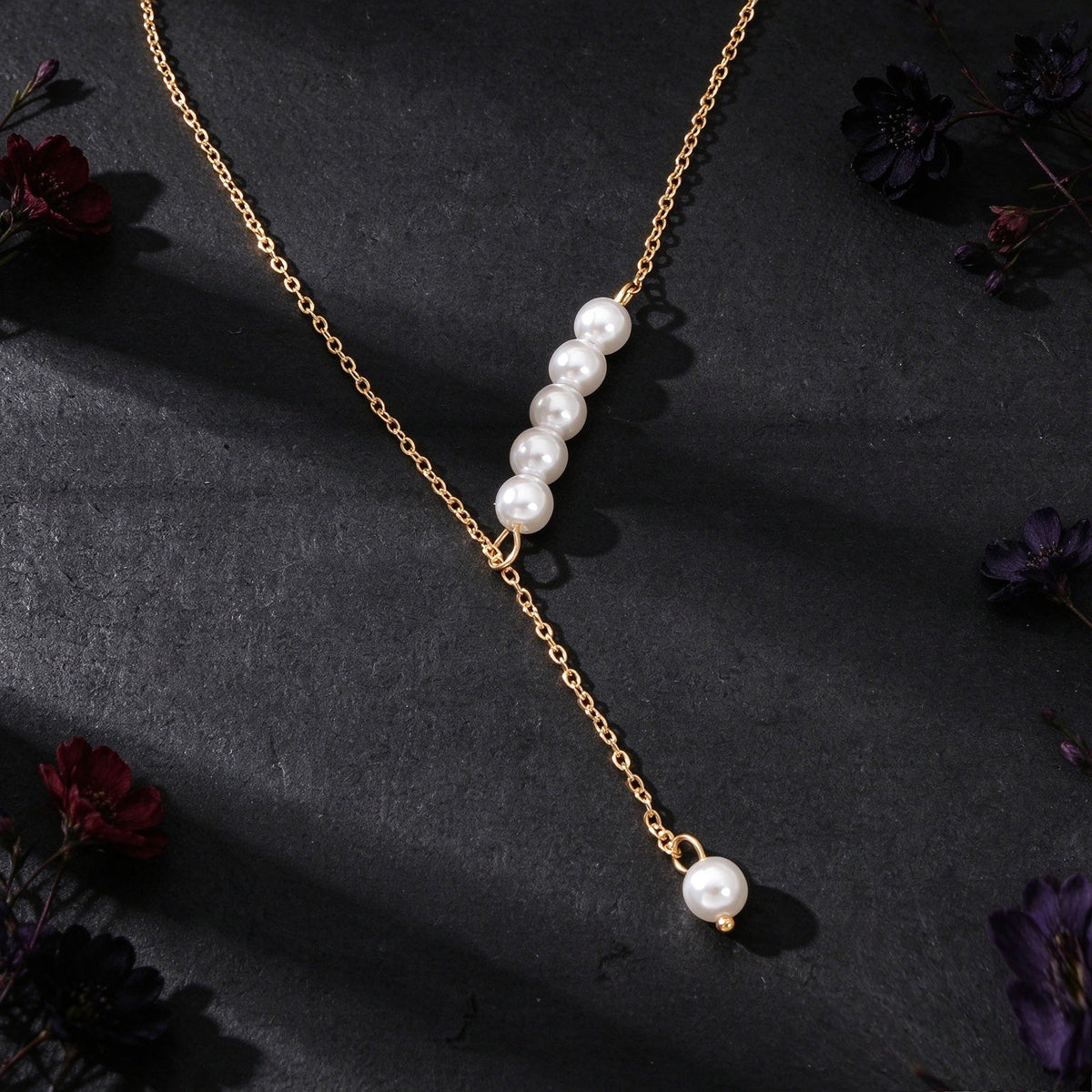 Gold Y-shaped pearl necklace with 3-bead cluster and dangling drop pearl