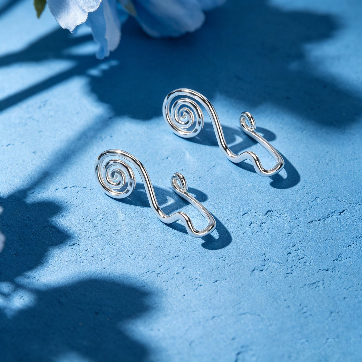 Silver spiral ear cuff set with curved clip design, no-piercing
