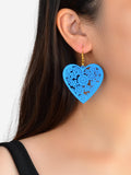 Blue heart dangle earrings with hollow floral cutout and gold hook