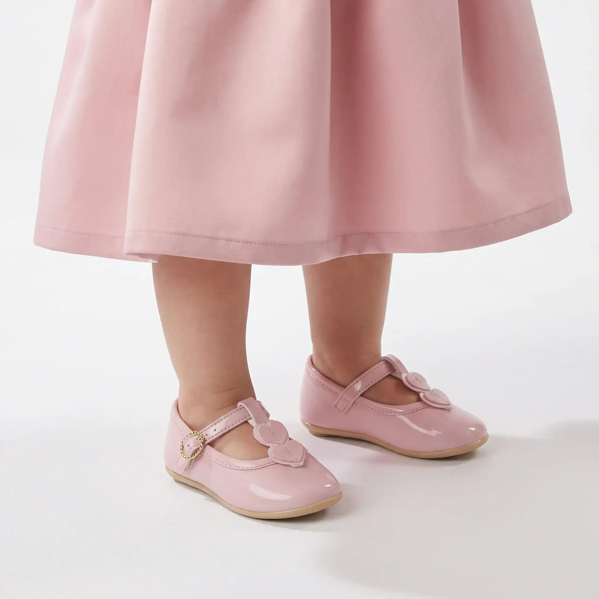 Blush baby Mary Jane formal shoes with heart appliques and adjustable strap