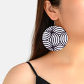 Round zebra-pattern dangle earrings with silver hook, black and white swirl design