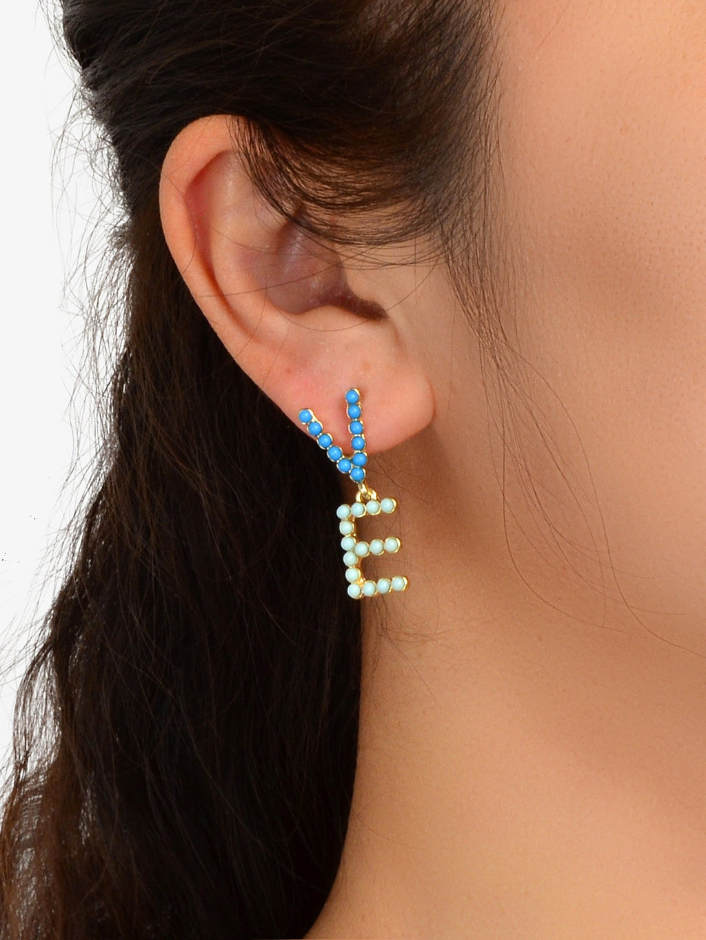 Beaded LOVE letter stud earrings with dangling blue beads on hook, close-up