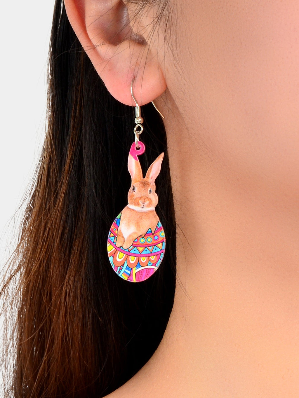 Bunny charm dangling earrings with multicolor egg-pattern body and pink top loop