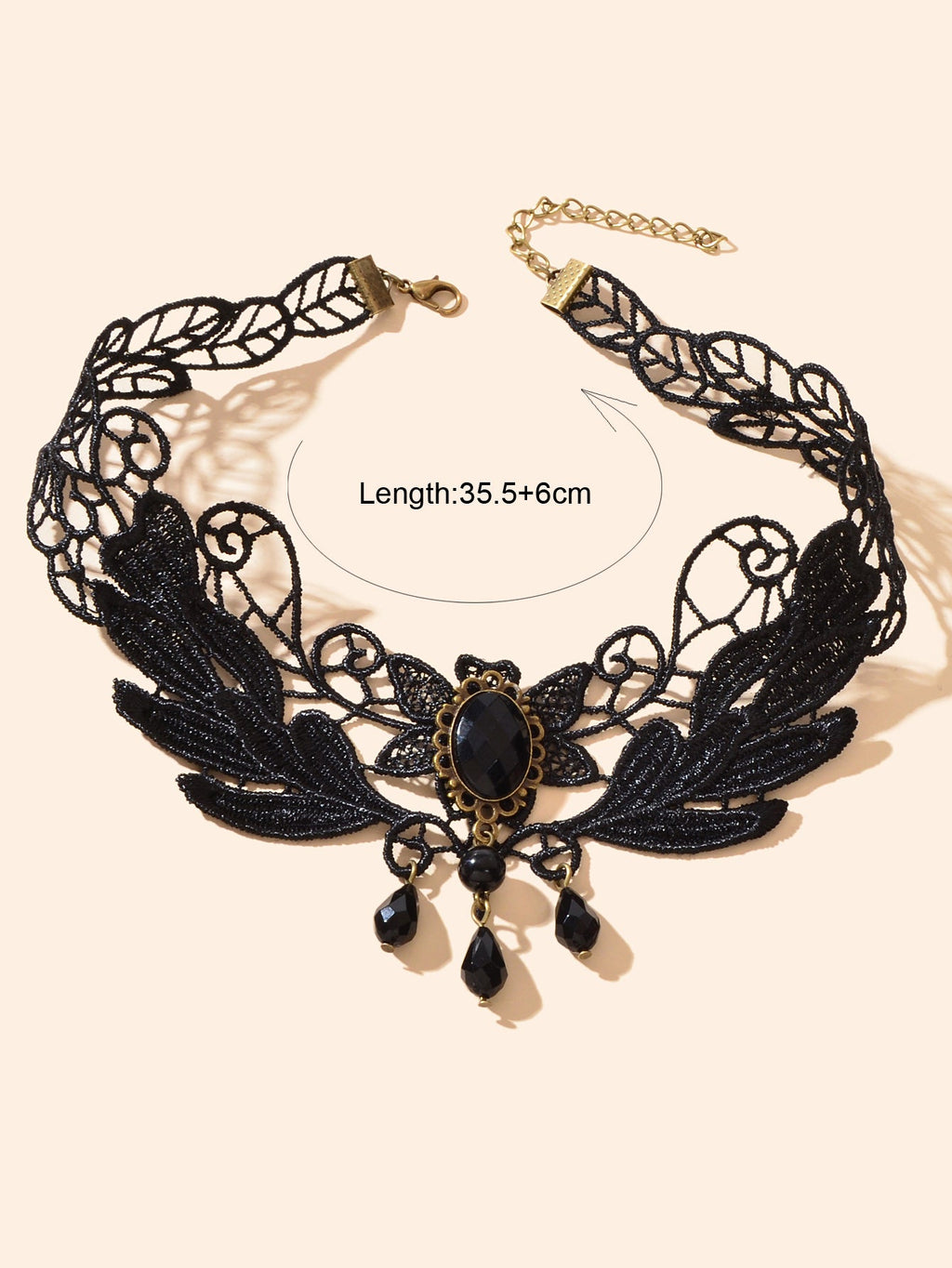 Black lace leaf choker with gold filigree oval gem and dangling teardrop charms