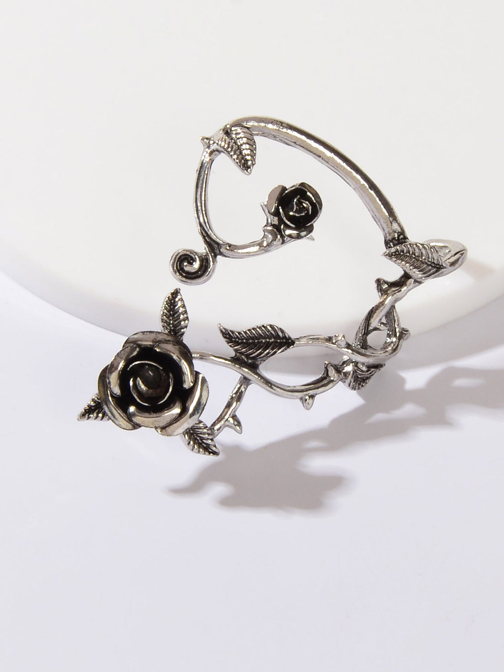 Silver-tone rose ear climber cuff wrap with black flower and bird-like accents