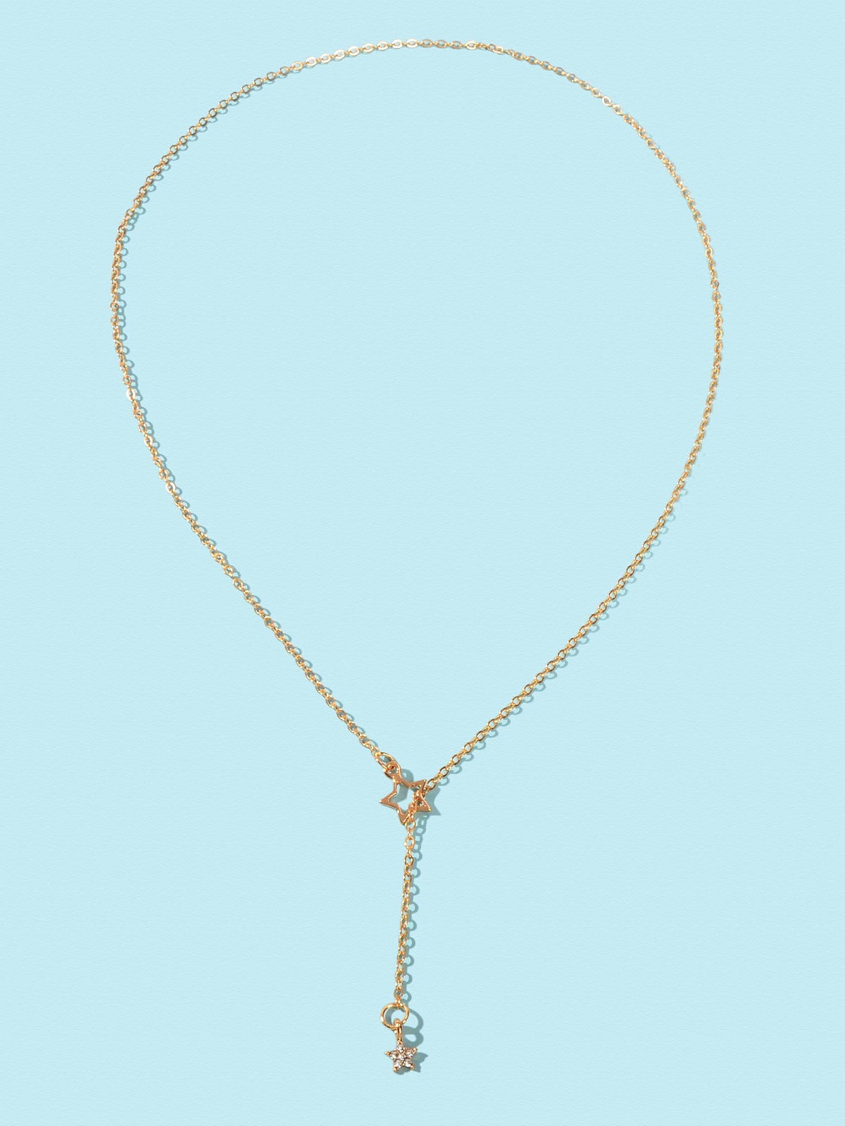 Gold Y-shaped chain necklace with star charm pendant and two dangling stars