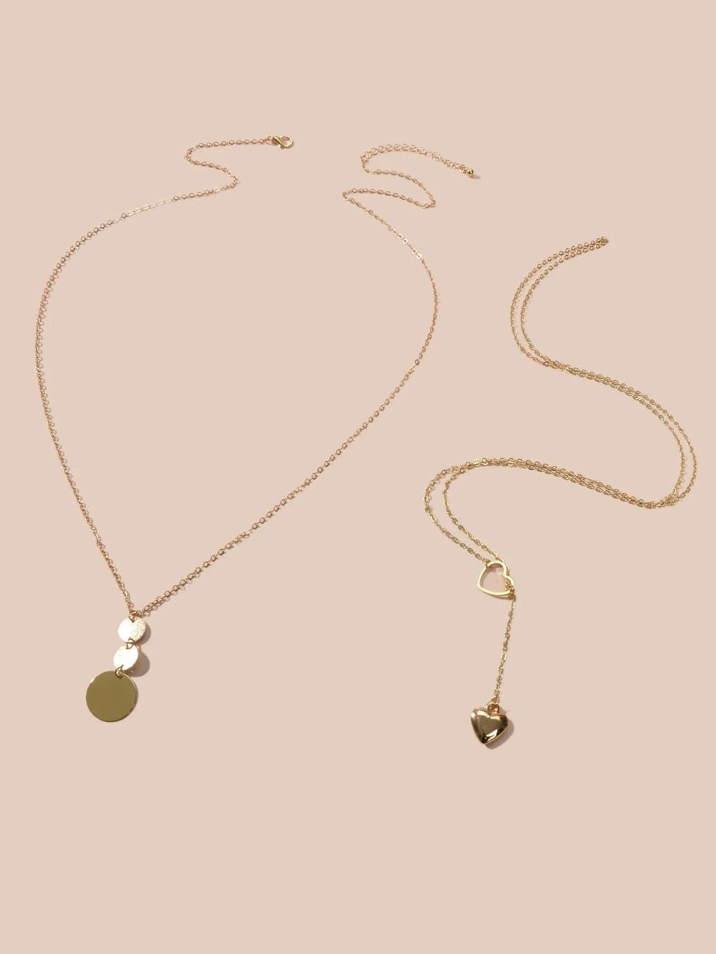 Gold-tone chain necklace set with heart and round disc pendants