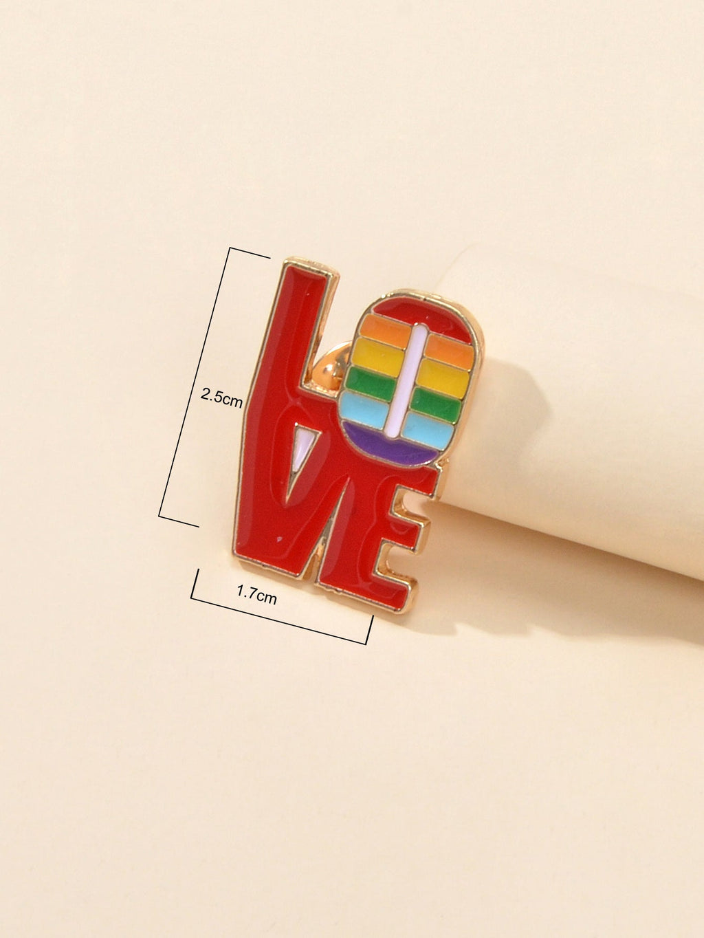Red enamel LOVE brooch pin with rainbow heart detail, size 2.5cm x 7.7cm