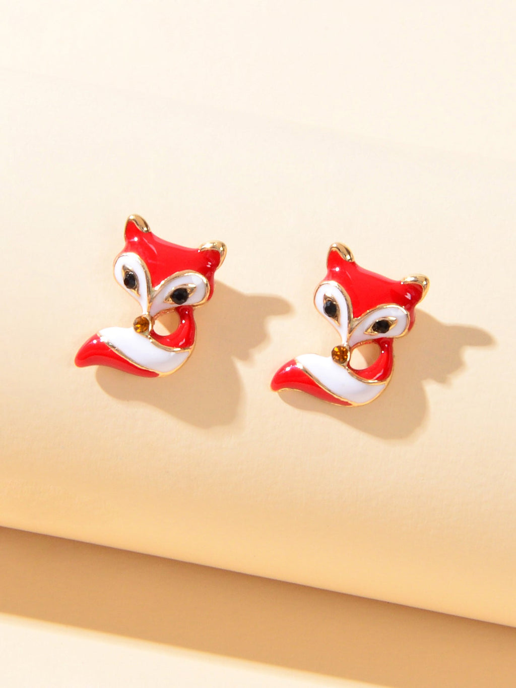 Pair of red and white fox enamel stud earrings with gold-tone settings