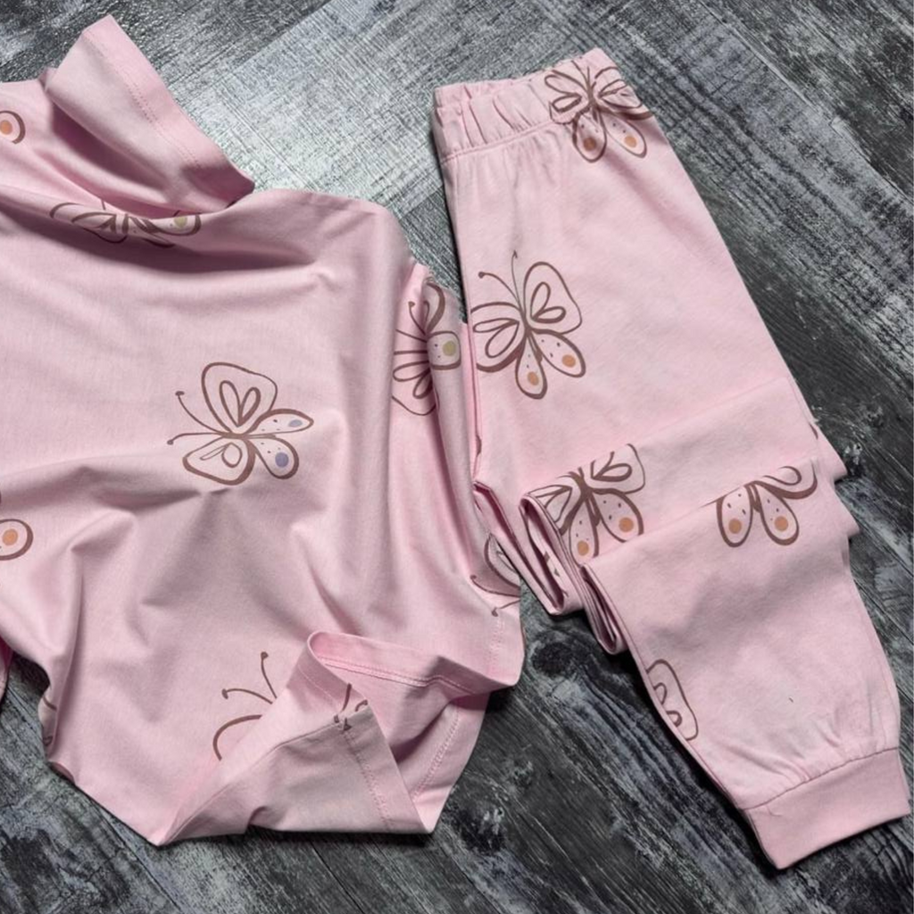 Girls' pink butterfly-print pajama set with matching pants shown flat