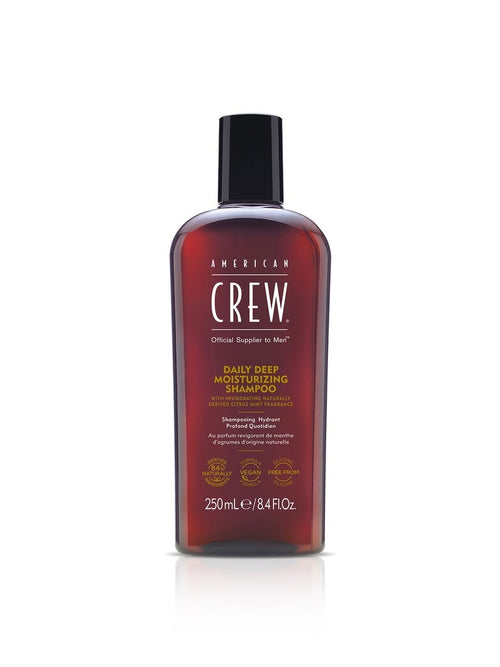 American Crew daily deep moisturizing shampoo bottle, 250 ml, amber-red liquid