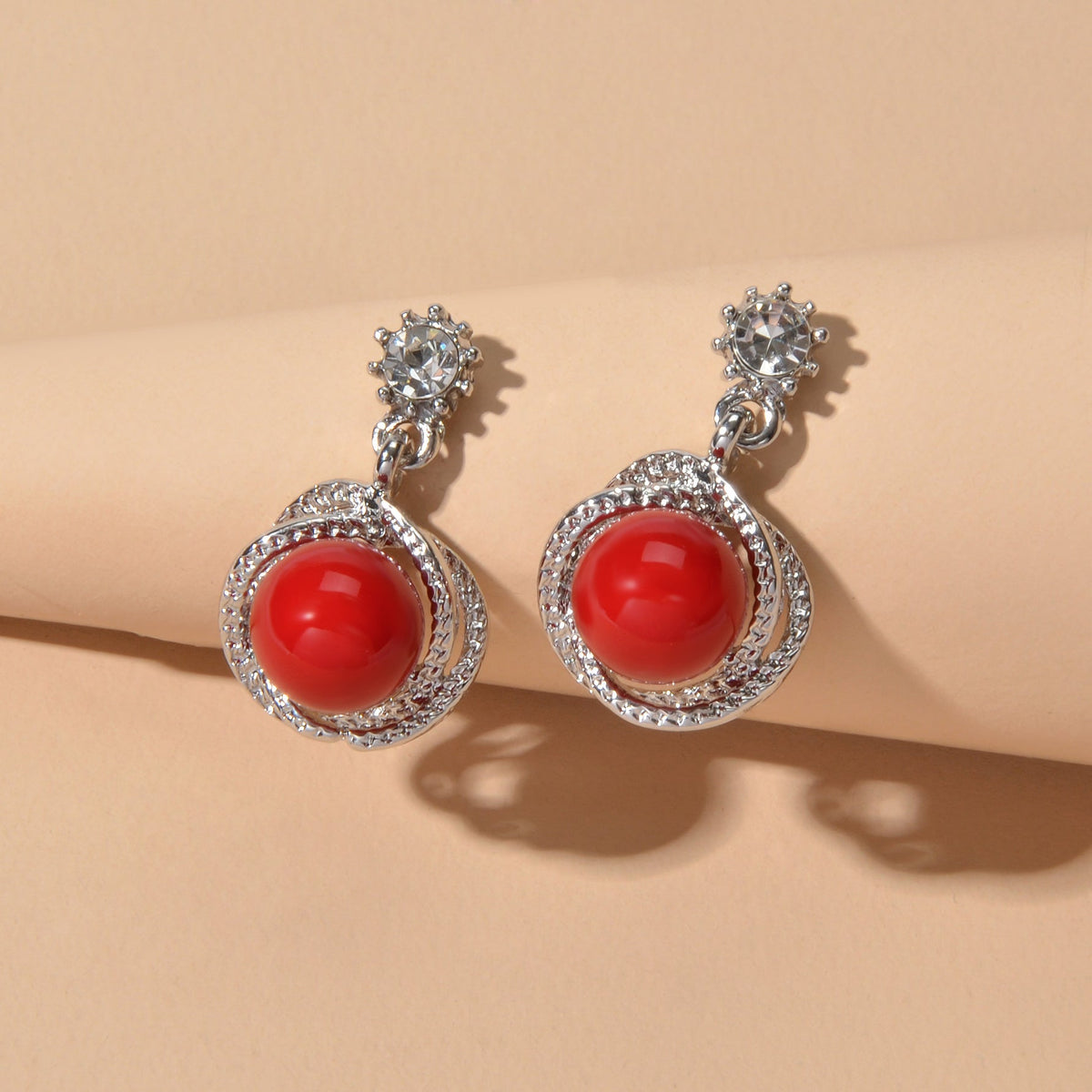 Silver-tone red round drop earrings with rhinestone frame and crystal flower tops