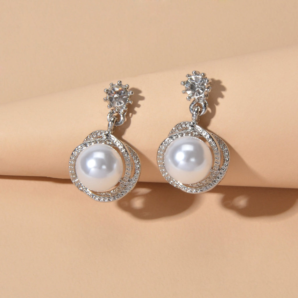 Silver-tone round pearl drop earrings, rhinestone bezel and top crystal stud