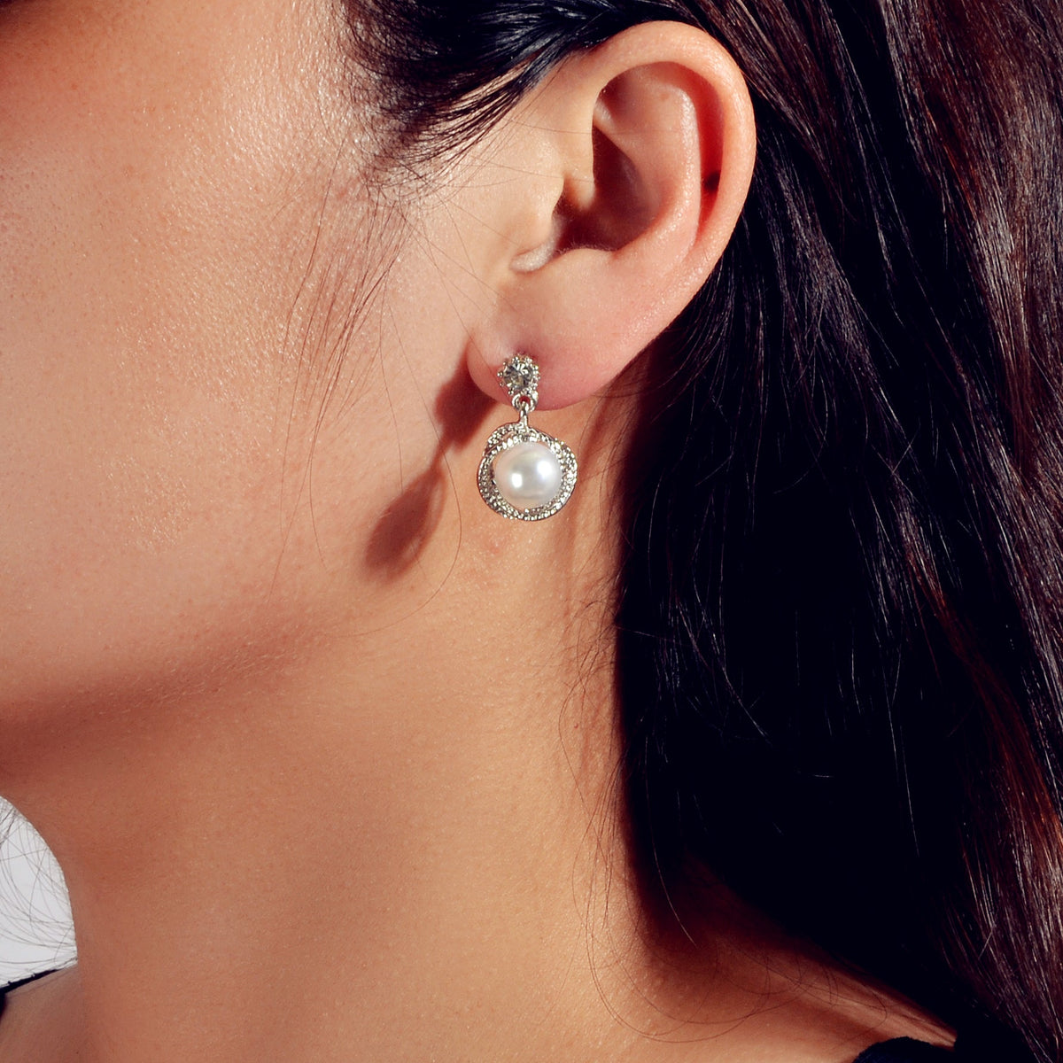 Silver-tone pearl drop earrings with small crystal stud and circular halo