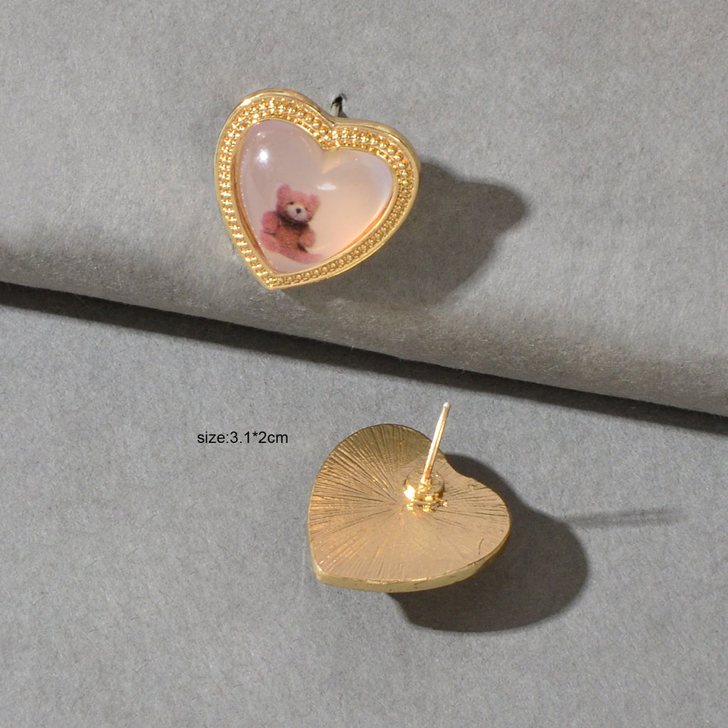 Gold heart resin stud earrings with pink bear image, stud back visible