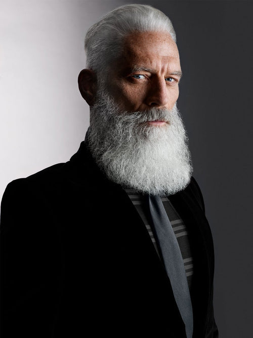 Silver shampoo lifestyle image: man with gray hair and full gray beard