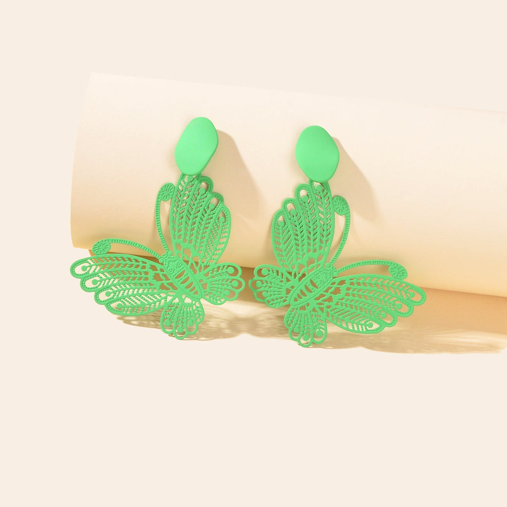 Green hollow butterfly stud earrings, two leaf-cutout charms on stud posts
