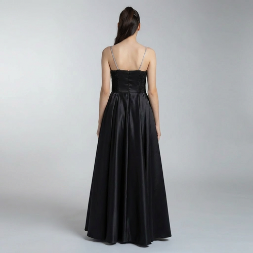 Girls black satin formal dress with open back, spaghetti straps, and gathered skirt