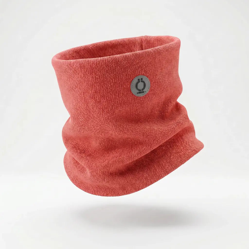 Coral red knitted neckwarmer with small circular logo patch on the front