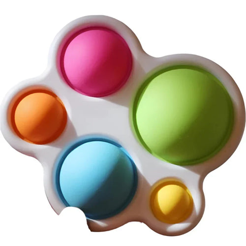 Baby rattle puzzle toy with five colorful spinning buttons in white housing