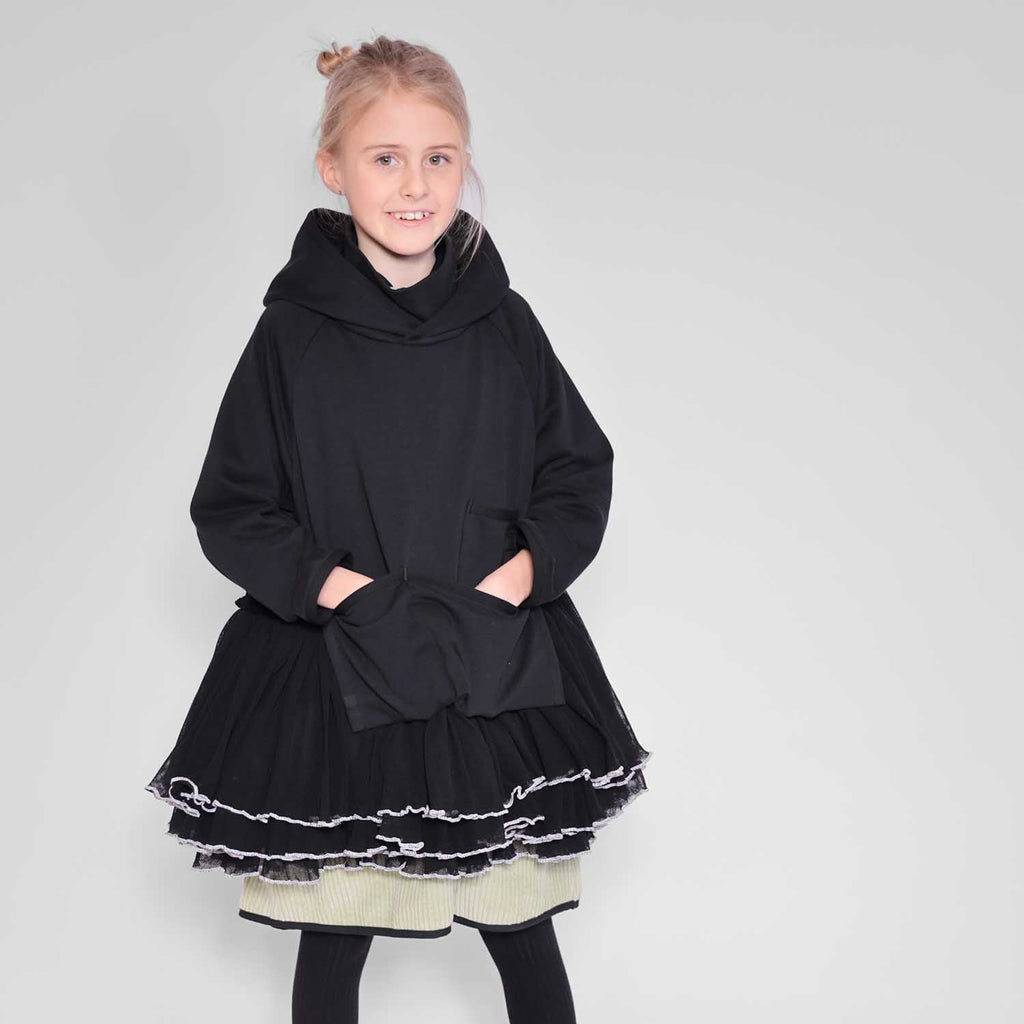 Black hooded tulle dress with short layered skirt and white chain trim hem
