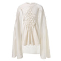Girls' white smock dress with attached cape and textured front panel