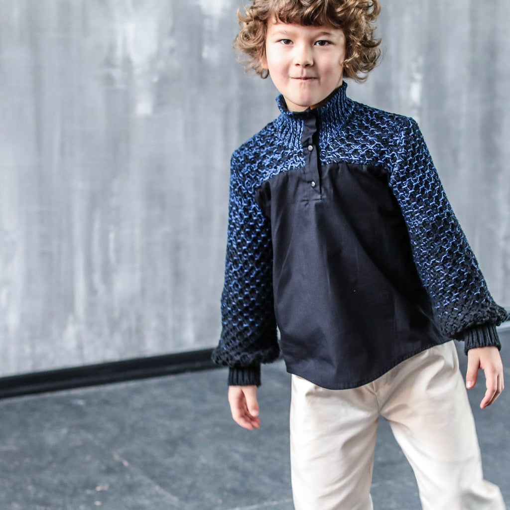 Light beige dress pants on a child, with extra-large pockets and wide legs