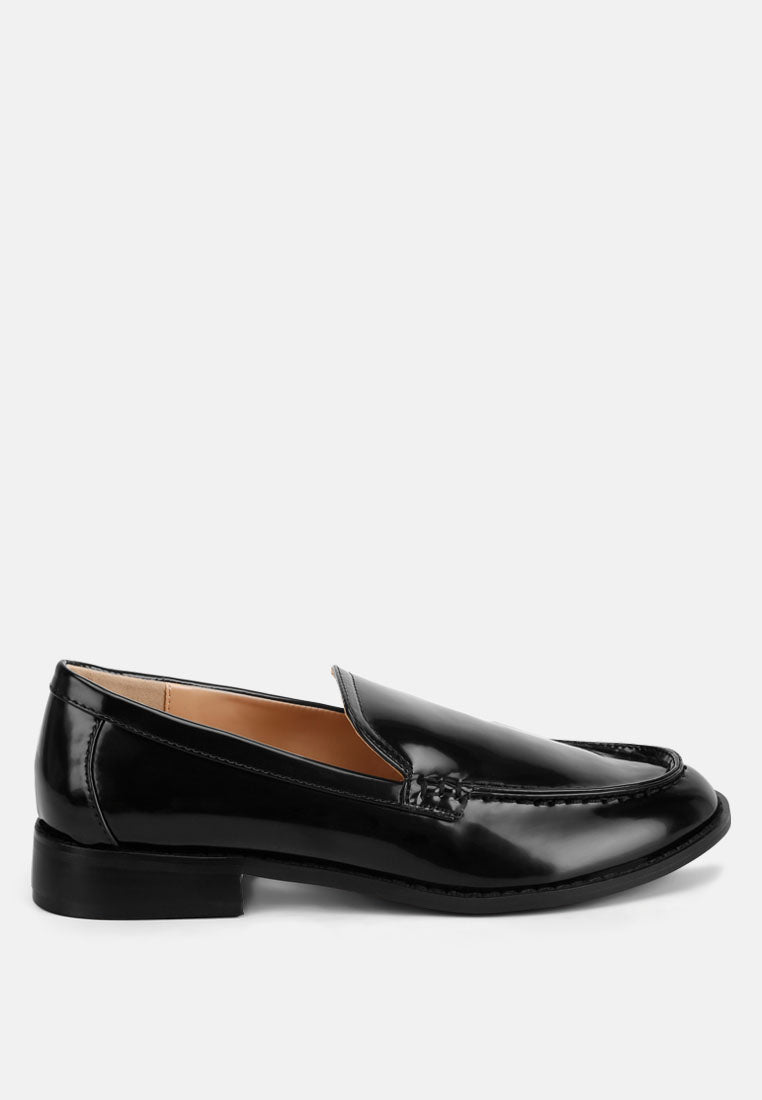 Black pleather loafers with stacked heel, glossy finish, side angle