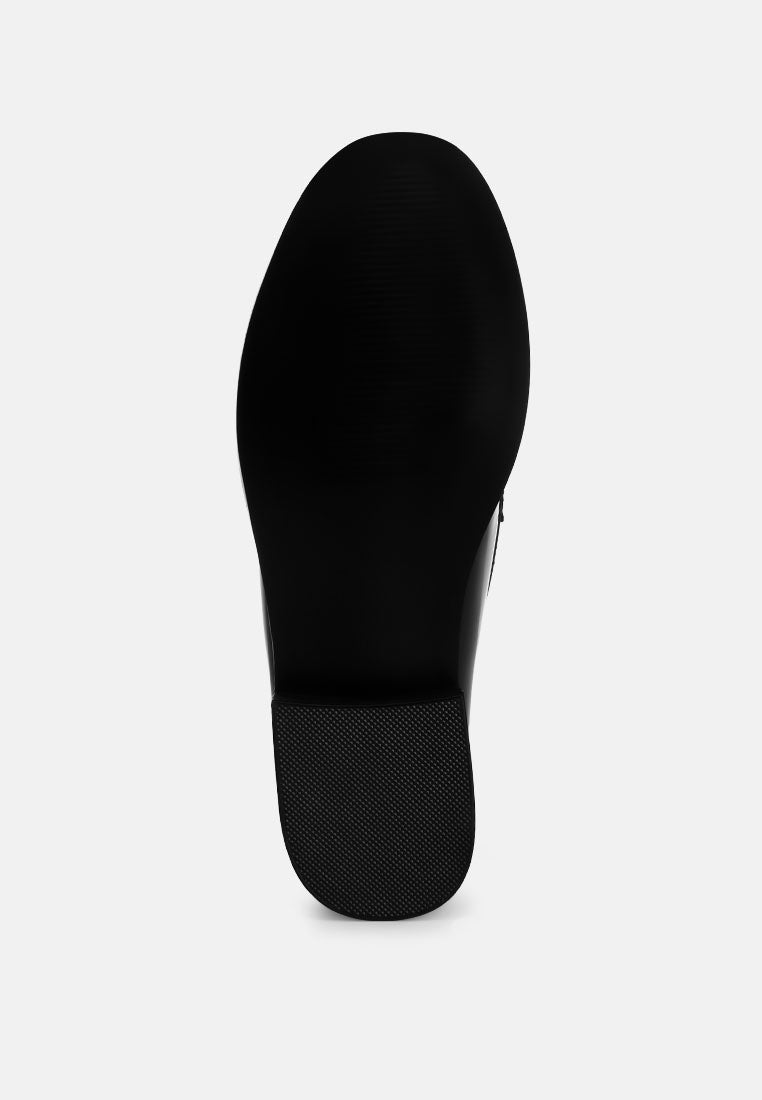Black loafer outsole bottom view with textured tread
