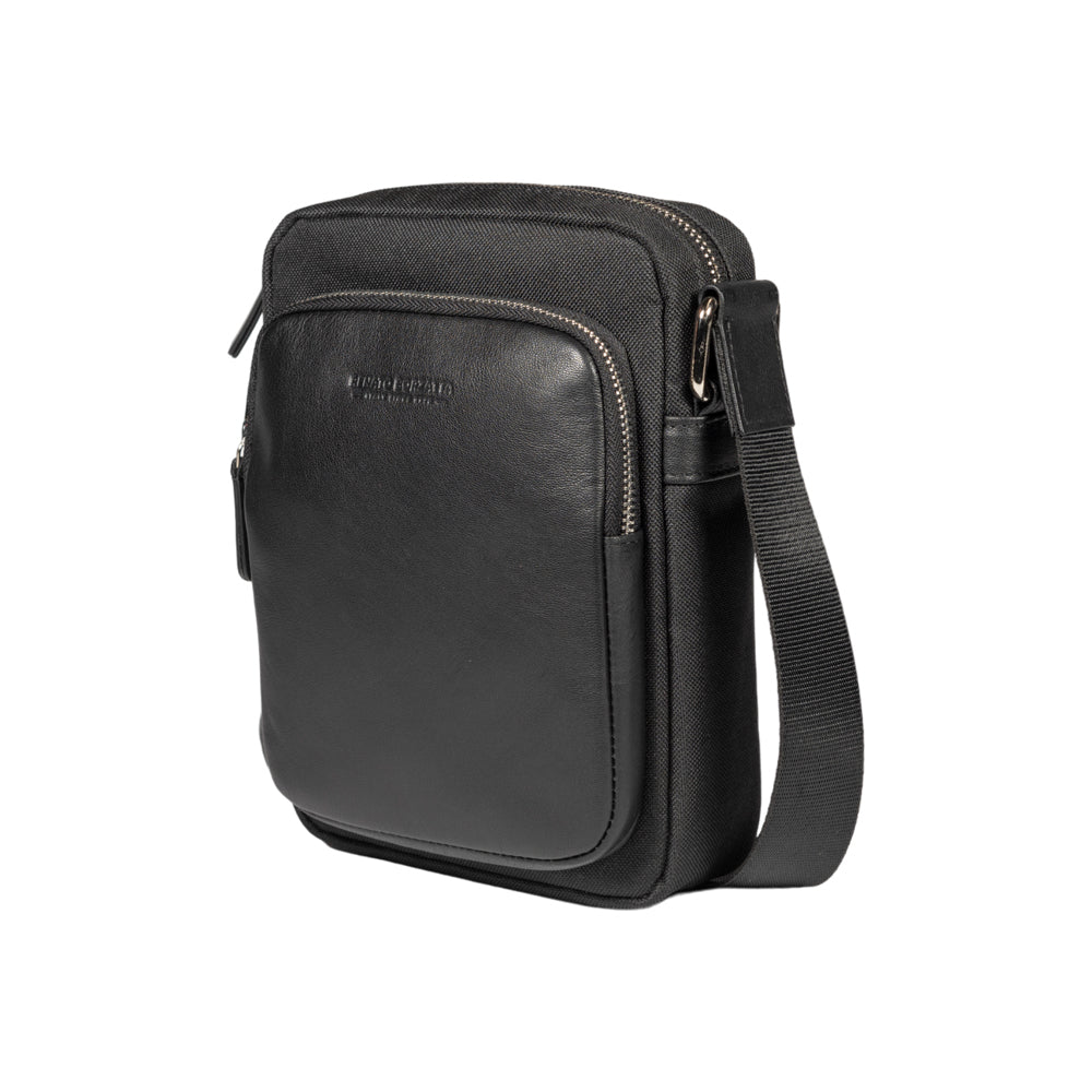 RB2002A | Nylon/Vera Leather Shoulder Bag, with light grain. Zipper closure and adjustable shoulder strap - Black color - Size: 15.5 x 21 x 7 cm. Packaging: Non-Woven Fabric Bag - Bag at Dealshubindia