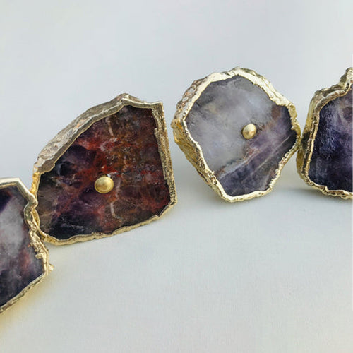Amethyst slice cabinet knob with gold-tone round pull and gold-edged purple stone
