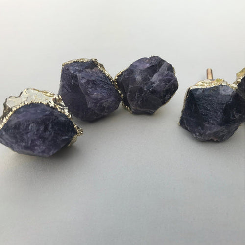 Set of amethyst crystal cabinet drawer knobs with gold-tone bases, rough dark-purple pieces