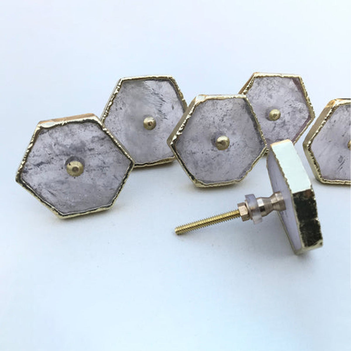 Hexagon cabinet drawer pull set with silver face and gold-tone edges, side screw fitting