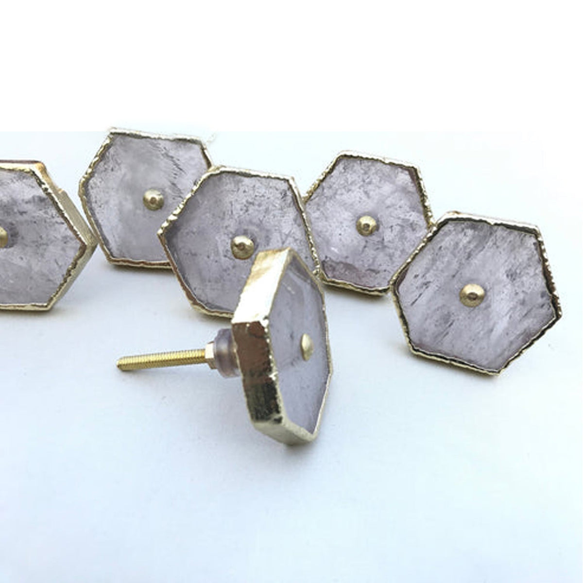 Hexagon cabinet drawer pull set with silver textured face and gold-tone rim, visible knobs