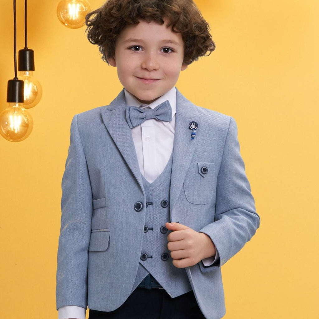 Boys light blue formal 3-piece suit with bow tie, blazer, vest, and dark trousers
