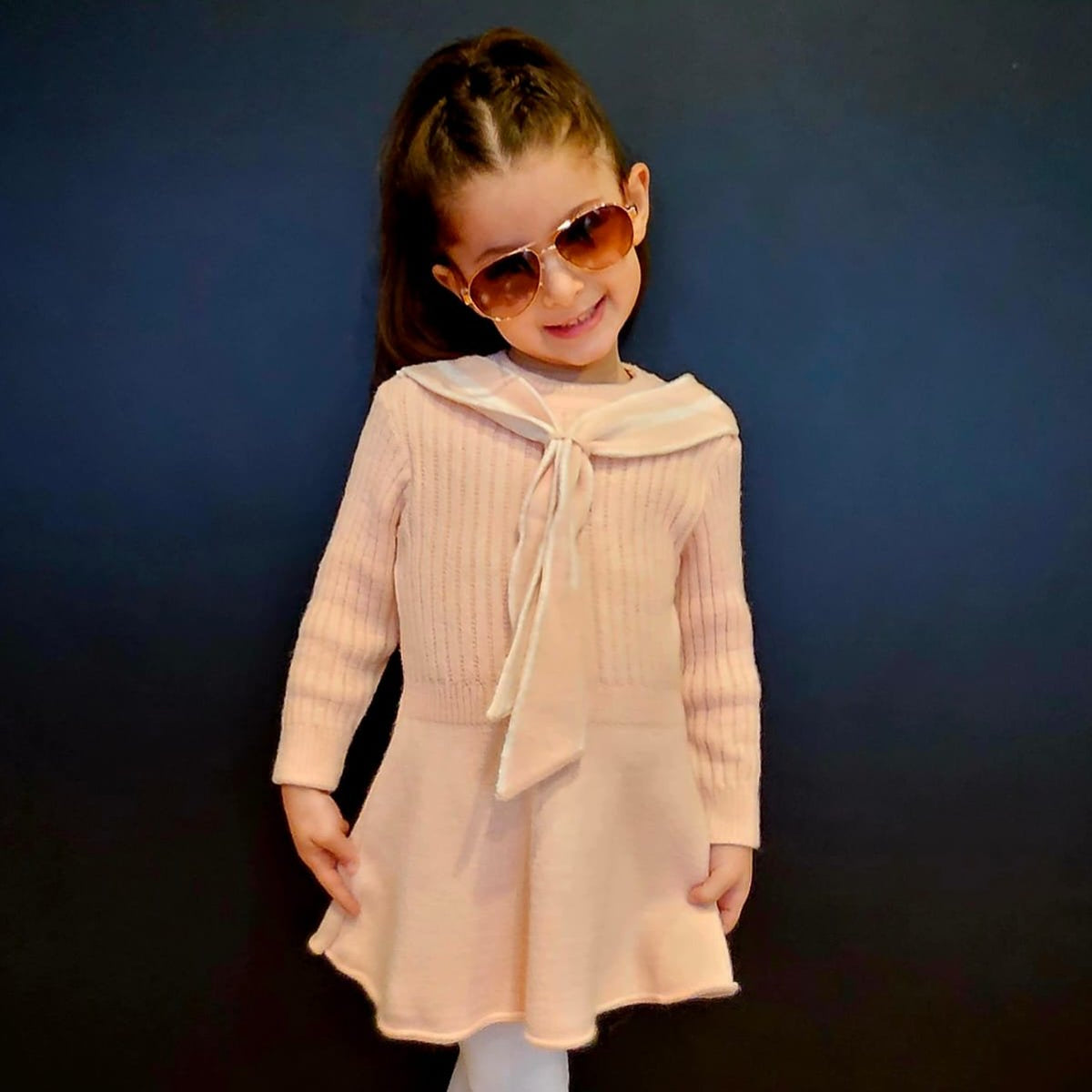 Girls casual dress with long sleeves, bow-tied collar, and flared skirt