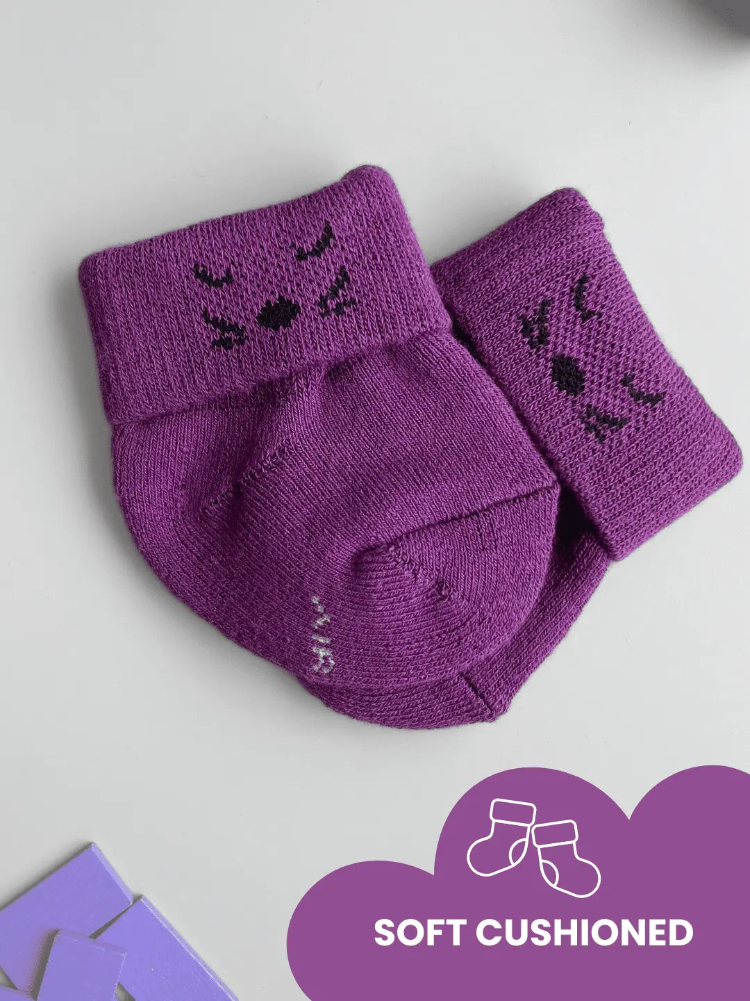 Air Garb high-quality cotton baby combo socks for ages 0-1 years; features pairs of socks in lime green, royal blue, and deep purple with embroidered kitten faces on the cuffs.