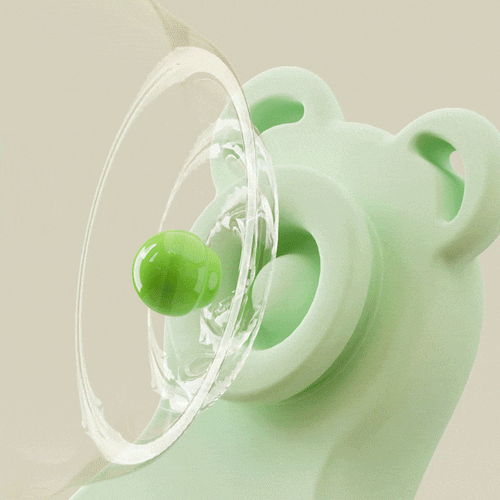 Green wearable intimate massager device with clear suction cup-style base.
