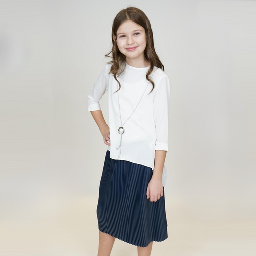 Girls casual set: white top with pleated navy accordion skirt, front view