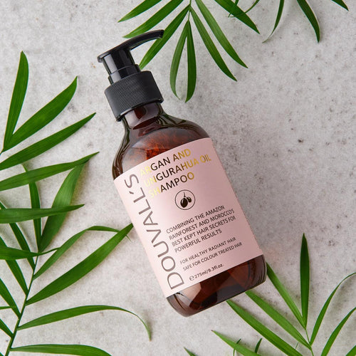 Amber shampoo bottle with black pump, angled view; Argan and Ungurahua oil label