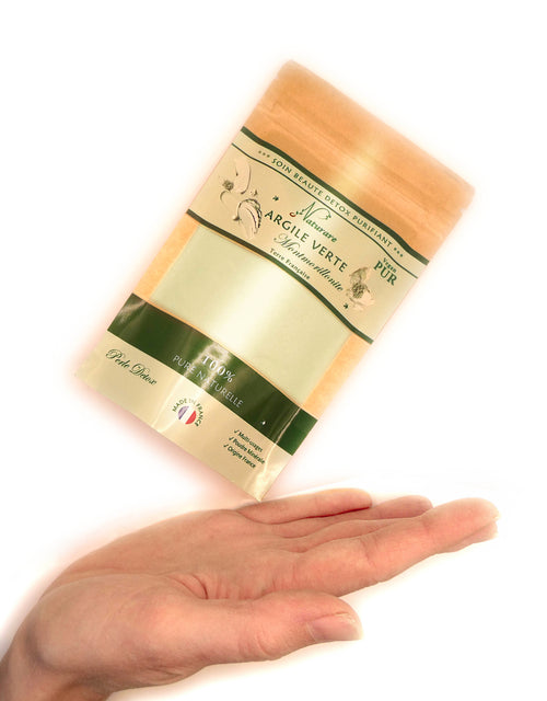 Green montmorillonite clay detox powder pouch held in hand