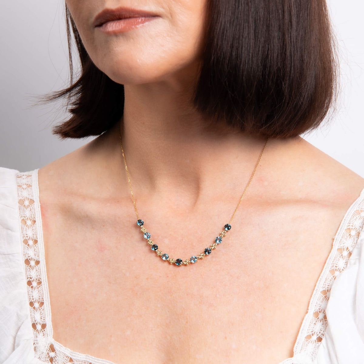 Elements Gold Ornate Blue Topaz Necklace-1