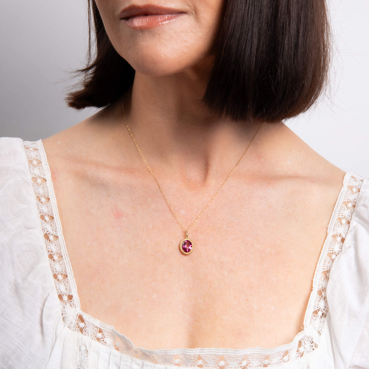 Elements Gold Oval Cut Pink Topaz Pendant-1